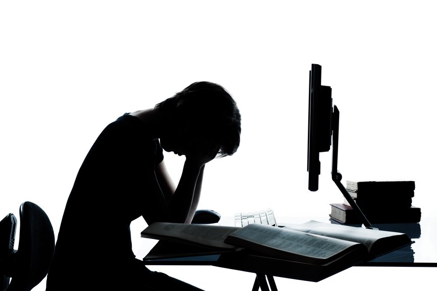 one caucasian young teenager silhouette boy or girl studying with computer computing laptop tired sad despair in studio cut out isolated on white background