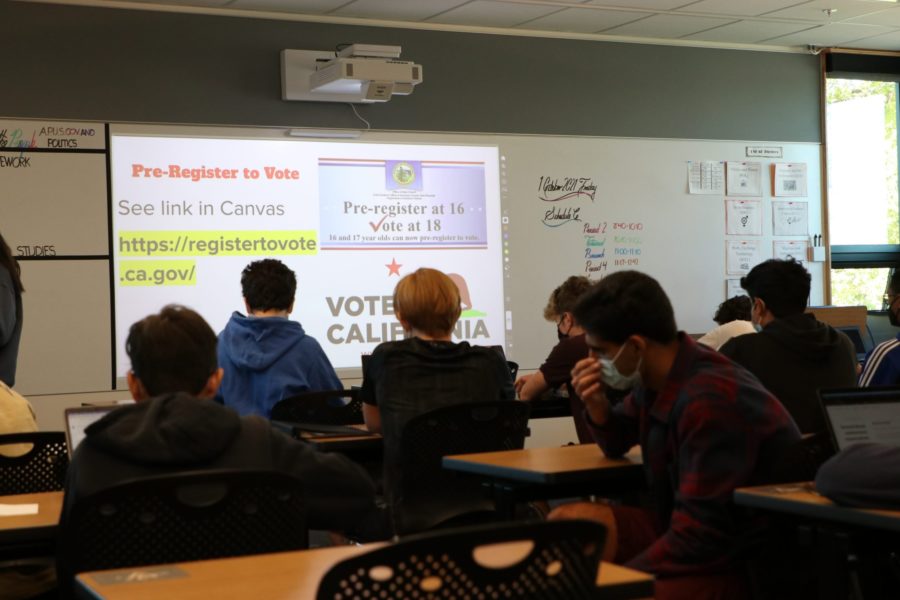 Students register to become future voters with guidance from school