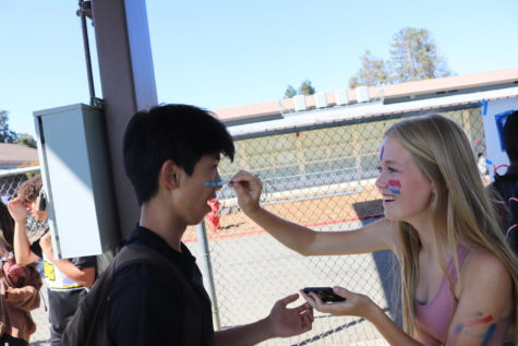 Students applied red, white, and blue face paint to show their school spirit. 